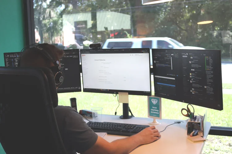 Engineer looking at monitors while preventing a cybersecurity attack